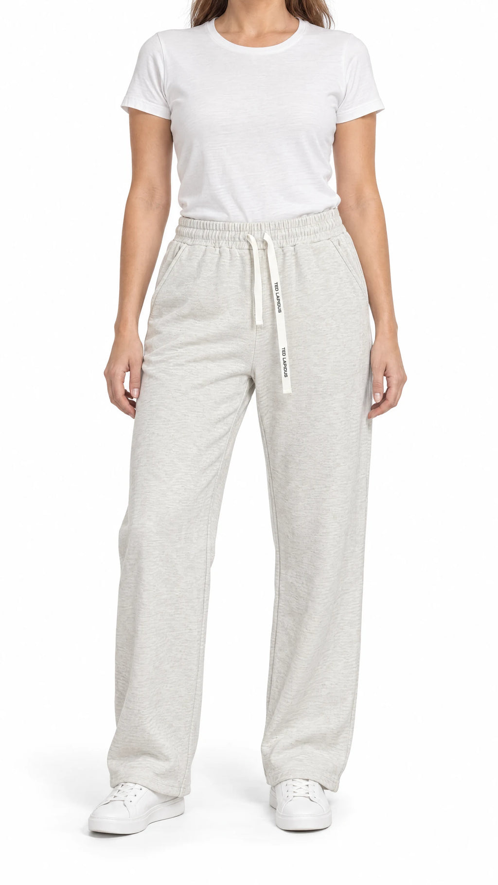 Pantalon thermo femme Ted Lapidus crème, coupe droite et taille élastiquée, porté de face.