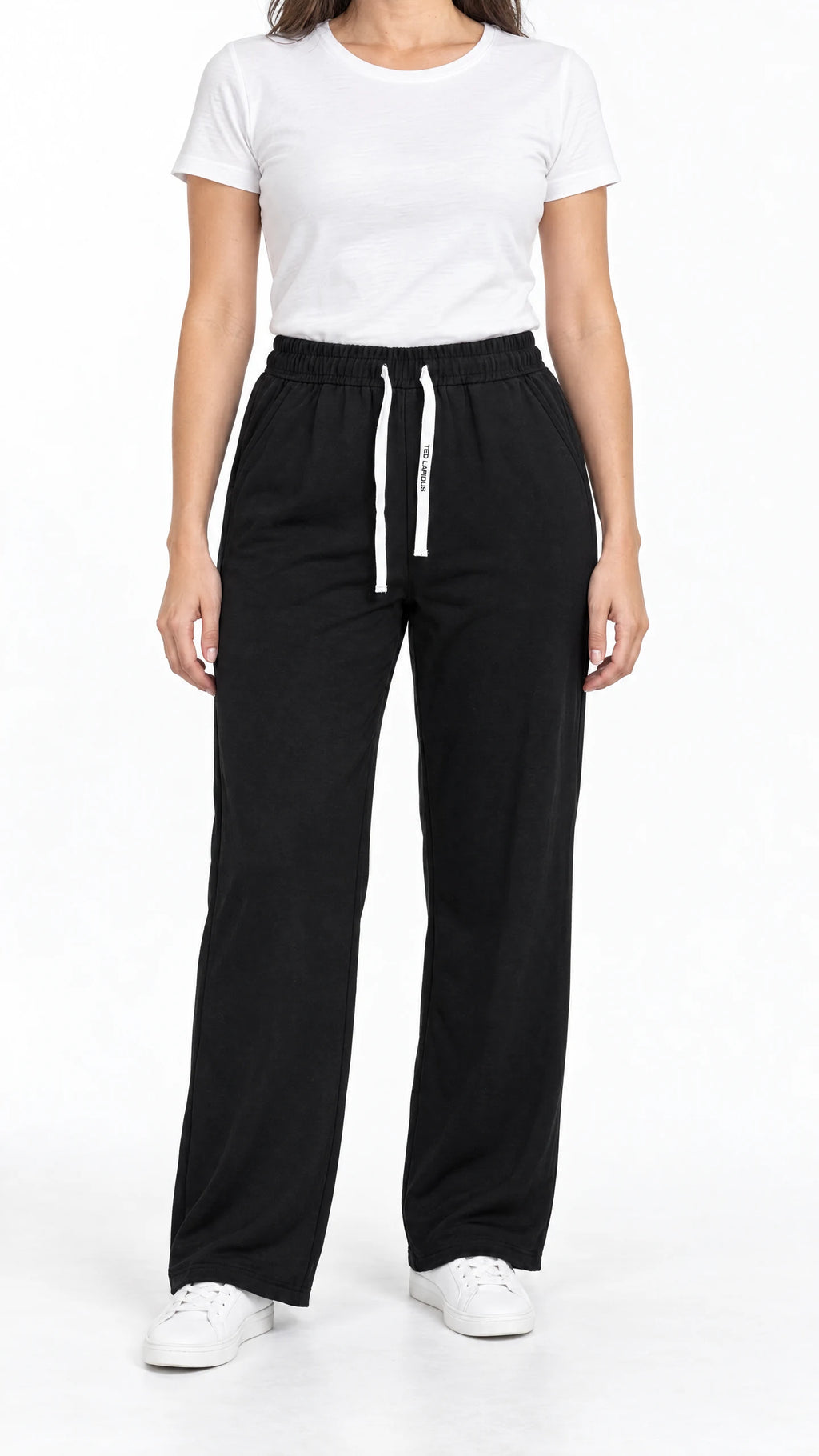Pantalon thermo femme Ted Lapidus noir, coupe droite et taille élastiquée, porté de face.